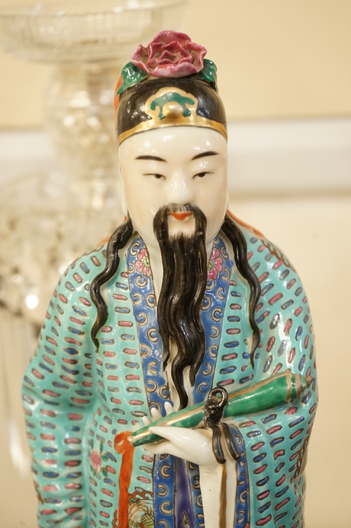 A Chinese enamelled porcelain figure of an immortal, Republic period, 32.5cm high